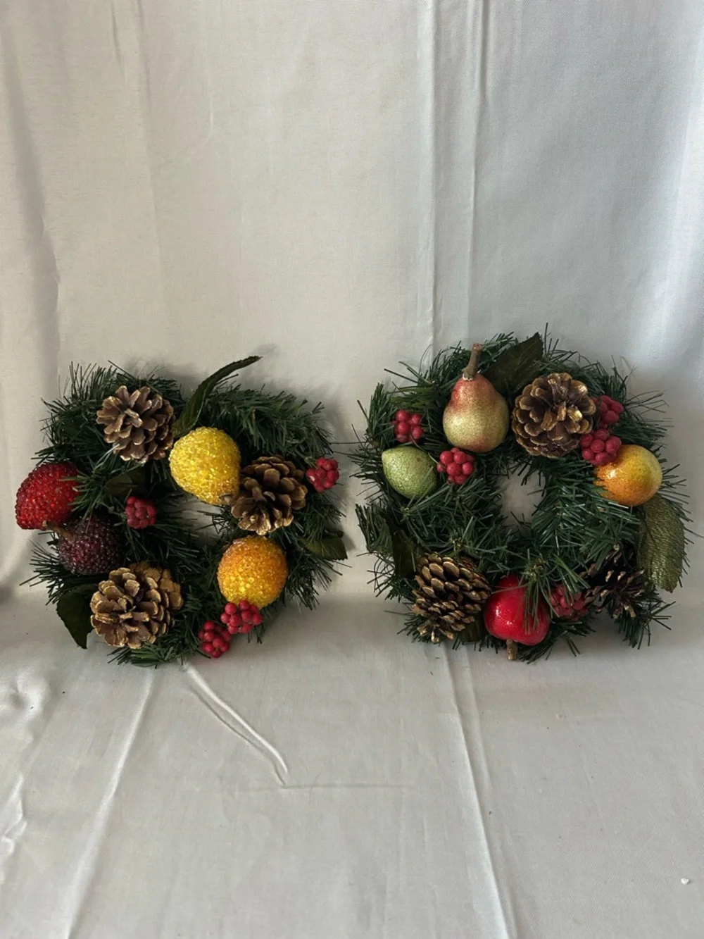 VTG artificial wreath/candle ring w/faux fruit, pinecones, and red berries.